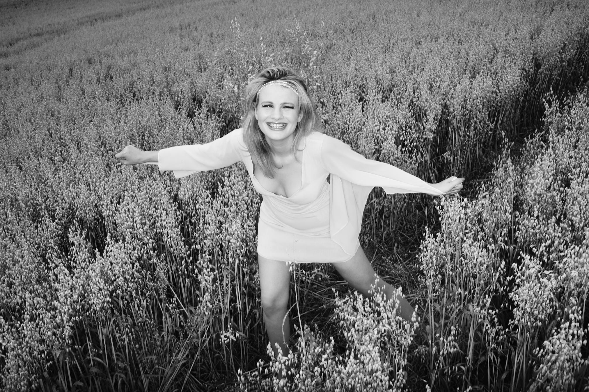 Chloe-Jasmine Whichello in a field of Barley in Somerset. Monochrome